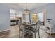 Bright dining area with a table for four, adjacent to the kitchen at 506-B Rosemary Ln., North Myrtle Beach, SC 29582