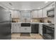 Modern kitchen with stainless steel appliances and a farmhouse sink at 506-B Rosemary Ln., North Myrtle Beach, SC 29582