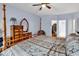 Bedroom featuring hardwood floors, a ceiling fan, and ensuite bath and walk-in closet at 541 Sand Ridge Rd., Conway, SC 29526