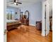 Bedroom featuring hardwood floors, a ceiling fan, and ensuite bath and walk-in closet at 541 Sand Ridge Rd., Conway, SC 29526