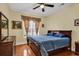 King-size bedroom with dark wood furniture and blue bedding at 541 Sand Ridge Rd., Conway, SC 29526