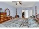 Bright bedroom with wood floors, a canopy bed, a dresser, and doors to a closet and bathroom at 541 Sand Ridge Rd., Conway, SC 29526