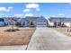 Single-story home with gray siding, brick accents, and a two-car garage at 541 Sand Ridge Rd., Conway, SC 29526