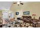 Living room with hardwood floors, leather furniture, and high ceilings at 541 Sand Ridge Rd., Conway, SC 29526