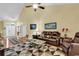 Spacious living room with leather furniture and a large area rug at 541 Sand Ridge Rd., Conway, SC 29526