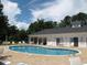 The community pool is surrounded by lounge chairs, and a building at 541 Sand Ridge Rd., Conway, SC 29526