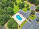 Aerial view of a community pool with lounge chairs, a pool house, and ample parking at 541 Sand Ridge Rd., Conway, SC 29526