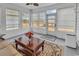 Cozy sunroom filled with natural light, neutral tones, and comfortable seating at 541 Sand Ridge Rd., Conway, SC 29526