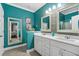 Double vanity bathroom with teal walls and walk-in shower at 5522 Elba Way # 5522, Myrtle Beach, SC 29579