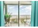 Bedroom features sliding glass doors opening to an ocean view balcony at 5905 S Kings Hwy. # A - 301, Myrtle Beach, SC 29575