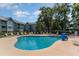 Community pool with surrounding lounge chairs at 5905 S Kings Hwy. # A - 301, Myrtle Beach, SC 29575