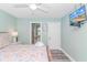 Bedroom with a queen bed, en-suite bathroom access, and TV at 6001-1027 S Kings Hwy., Myrtle Beach, SC 29575