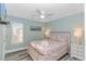 Bedroom with a queen bed, nightstands, and ceiling fan at 6001-1027 S Kings Hwy., Myrtle Beach, SC 29575