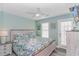 Spacious bedroom with a light-toned wood bed frame and ocean-themed decor at 6001-1027 S Kings Hwy., Myrtle Beach, SC 29575