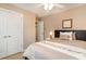 Cozy bedroom with a full-size bed, neutral color scheme, and access to a private bathroom at 6244 Catalina Dr. # 1411, North Myrtle Beach, SC 29582