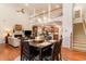 View of the dining area, with a fireplace, connecting to the living room and kitchen at 6244 Catalina Dr. # 1411, North Myrtle Beach, SC 29582