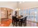 Elegant dining room with hardwood floors, stylish chandelier, and bright windows at 6244 Catalina Dr. # 1411, North Myrtle Beach, SC 29582