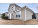 Tan house exterior with white trim, landscaping, and a side view of the garage at 6244 Catalina Dr. # 1411, North Myrtle Beach, SC 29582