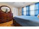 Bedroom with dark wood dresser and blue bedding at 676 Pelican Ave. # 676, Myrtle Beach, SC 29577