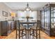 Well-lit dining room with round table and hutch at 676 Pelican Ave. # 676, Myrtle Beach, SC 29577