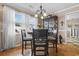 Dining area with round table, four chairs, and china cabinet at 676 Pelican Ave. # 676, Myrtle Beach, SC 29577