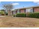 Front view of brick ranch house with well-maintained lawn at 676 Pelican Ave. # 676, Myrtle Beach, SC 29577