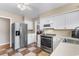 Stainless steel appliances and white cabinets in kitchen at 676 Pelican Ave. # 676, Myrtle Beach, SC 29577