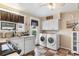 Kitchen with stainless steel appliances, white cabinets and laundry at 676 Pelican Ave. # 676, Myrtle Beach, SC 29577