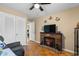 Cozy living room featuring a fireplace, hardwood floors, and built-in shelving at 676 Pelican Ave. # 676, Myrtle Beach, SC 29577