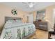 Main bedroom with dresser and floral bedding at 676 Pelican Ave. # 676, Myrtle Beach, SC 29577