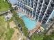 Aerial view showing resort pool, playground, and building at 6804 N Ocean Blvd. # 1117, Myrtle Beach, SC 29572