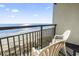 Oceanfront balcony with chairs, offering stunning ocean and beach views at 6804 N Ocean Blvd. # 1117, Myrtle Beach, SC 29572