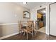 Small dining area with wood table and chairs at 6804 N Ocean Blvd. # 1117, Myrtle Beach, SC 29572