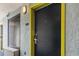 Hotel-style room entrance with a dark door and yellow trim at 6804 N Ocean Blvd. # 1117, Myrtle Beach, SC 29572