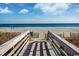 Wooden boardwalk leads to sandy beach with ocean view at 6804 N Ocean Blvd. # 1637, Myrtle Beach, SC 29572