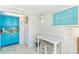 Beach-themed kitchen with teal cabinets and a small table at 6804 N Ocean Blvd. # 1637, Myrtle Beach, SC 29572