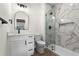 Bathroom offers modern vanity, glass shower, and tiled walls for a stylish and refreshing space at 7053 Byrnes Ln., Myrtle Beach, SC 29588
