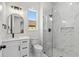 Modern bathroom with marble walk-in shower, sleek vanity, and elegant fixtures for a luxurious feel at 7053 Byrnes Ln., Myrtle Beach, SC 29588