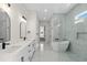 Luxurious bathroom boasts double vanity, soaking tub, and glass-enclosed shower for spa-like experience at 7053 Byrnes Ln., Myrtle Beach, SC 29588