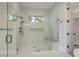 Elegant bathroom with a large walk-in shower, marble tile, and glass enclosure at 7053 Byrnes Ln., Myrtle Beach, SC 29588