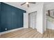 Well-lit bedroom features modern wainscoting and bright closet, providing a peaceful retreat at 7053 Byrnes Ln., Myrtle Beach, SC 29588
