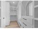 Walk-in closet features custom shelving, drawers, and ample storage space for organization at 7053 Byrnes Ln., Myrtle Beach, SC 29588