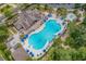 Aerial view of a large community pool, with plenty of space for swimming and lounging, complete with comfortable patio furniture at 7053 Byrnes Ln., Myrtle Beach, SC 29588