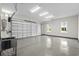 Spacious garage with epoxy flooring, utility sink, and two windows for natural light and added convenience at 7053 Byrnes Ln., Myrtle Beach, SC 29588