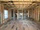 Expansive room under construction, showing exposed wood framework, highlighting the potential for an open, airy design at 7053 Byrnes Ln., Myrtle Beach, SC 29588