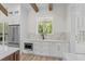 Kitchen nook featuring marble counters, stainless steel appliances, modern white cabinets, and a garden view at 7053 Byrnes Ln., Myrtle Beach, SC 29588