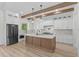 Modern kitchen with island, white cabinets, stainless steel appliances, and open design for easy cooking and entertaining at 7053 Byrnes Ln., Myrtle Beach, SC 29588