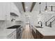 Spacious kitchen includes a central island, stainless steel appliances, marble counters, and hardwood floors at 7053 Byrnes Ln., Myrtle Beach, SC 29588
