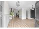Inviting living room with wood floors, light walls, and open concept flowing to kitchen for easy living at 7053 Byrnes Ln., Myrtle Beach, SC 29588