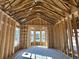 Framed living room featuring high ceilings, windows and an open floor plan at 7053 Byrnes Ln., Myrtle Beach, SC 29588